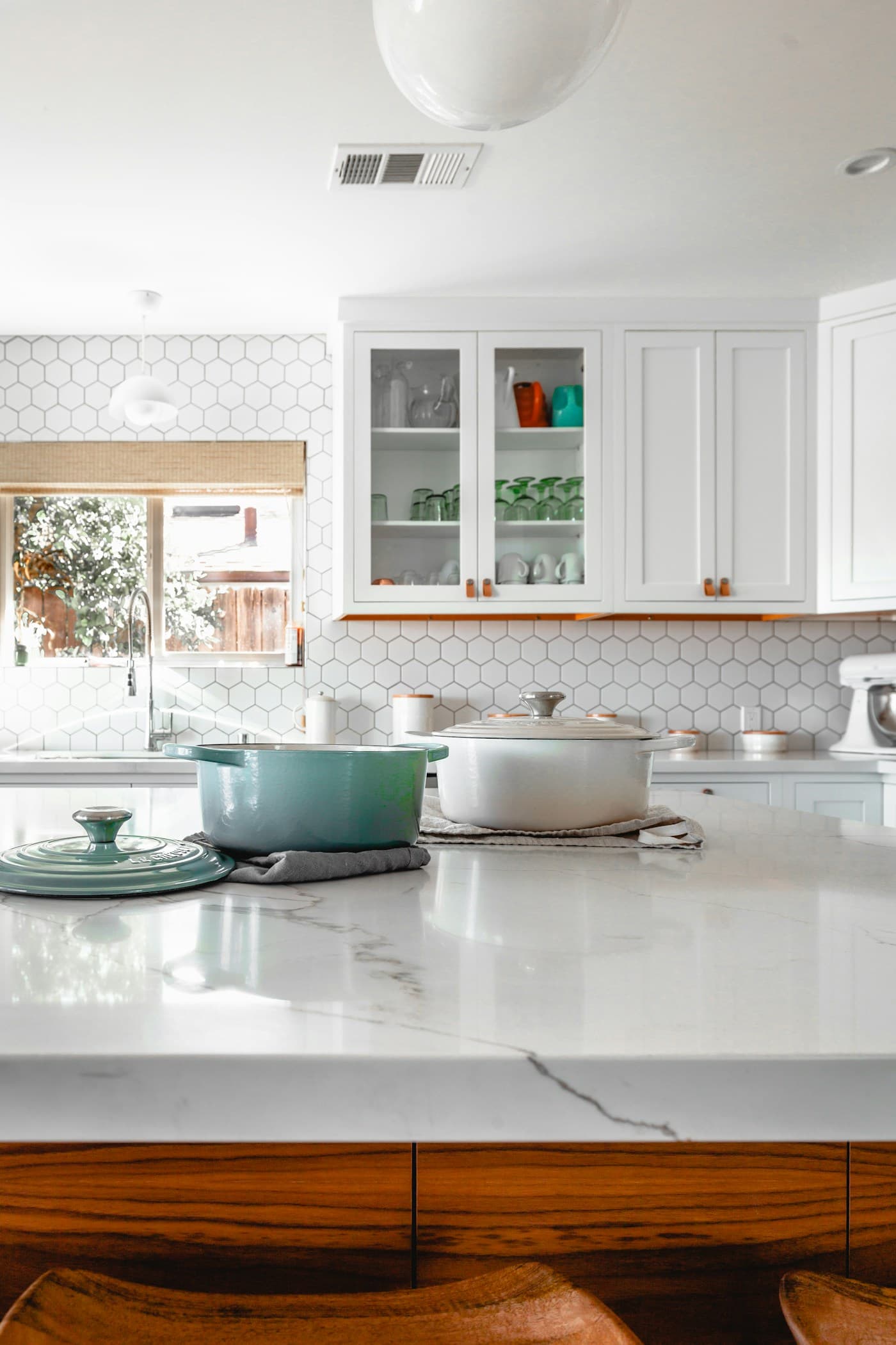 Warm modern kitchen with natural wood tones and soft lighting